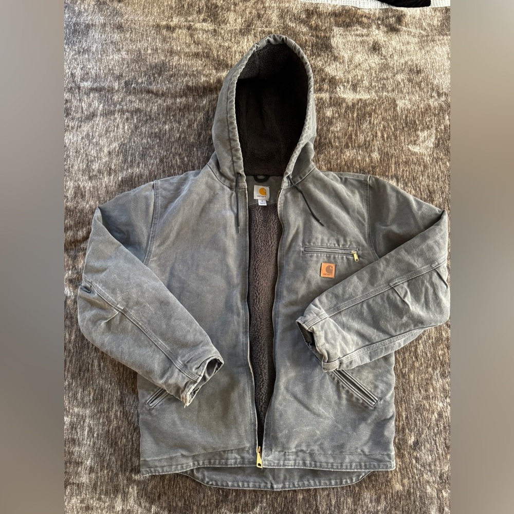 Perfectly worn (and with no damage) hooded Carhartt jacket.